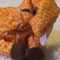 The image shows a Ty Beanie Baby Twigs the Giraffe. This collectible plush toy was introduced in 1995 and retired in 1998. 