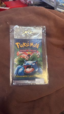 Pokemon original sealed vintage 1999 Wizards of the Coast (WOTC) Pokémon Base Set Unlimited booster pack with the iconic Venusaur artwork.