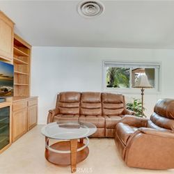 Power Recliner Chair Shown On Right