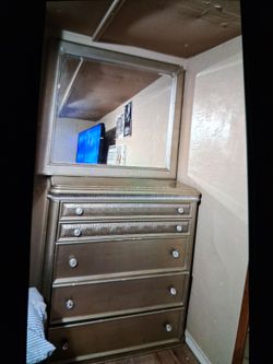 Two dressers and a mirror