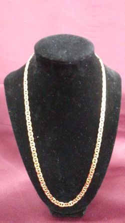 A handsome 22 inch Figuero chain in 10k solid gold. This unisex beauty boasts a 27GRM weight and a lobster claw clasp. $1,300.