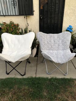 2 Brand New Butterfly Folding Chairs with Storage Bags $30 each.