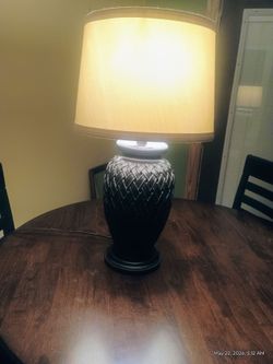 Nice sturdy lamp. Cream color shade and dark brown base.