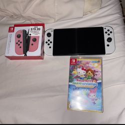 Nintendo switch oled W Controllers And Hello kitty Island Adventure 