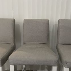 Three grey chairs