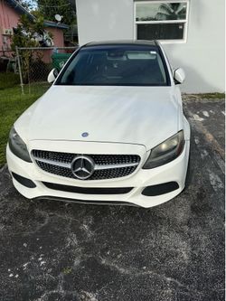 White Mercedes Benz c(contact info removed) with black panoramic top