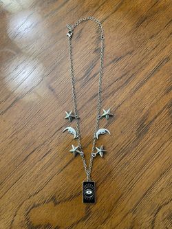 Silver Toned Necklace With Stars, Moons, and Eye Pendant Design - Like New