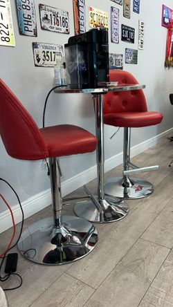 Red Swivel Adjustable Barstools And High top Metal Table (trio)