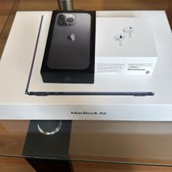 Empty Boxes Of Macbook Air And The Airpod Pros Along With The iPhone 13 Pro
