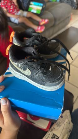 Gray and black Nikes 4c