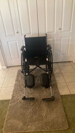 Wheelchair New with 18” seat and elevating footrests