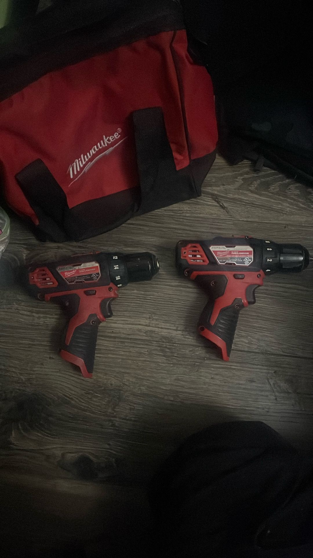 2 Milwaukee M12 12V Cordless 3/8 in. Drill Driver And bag