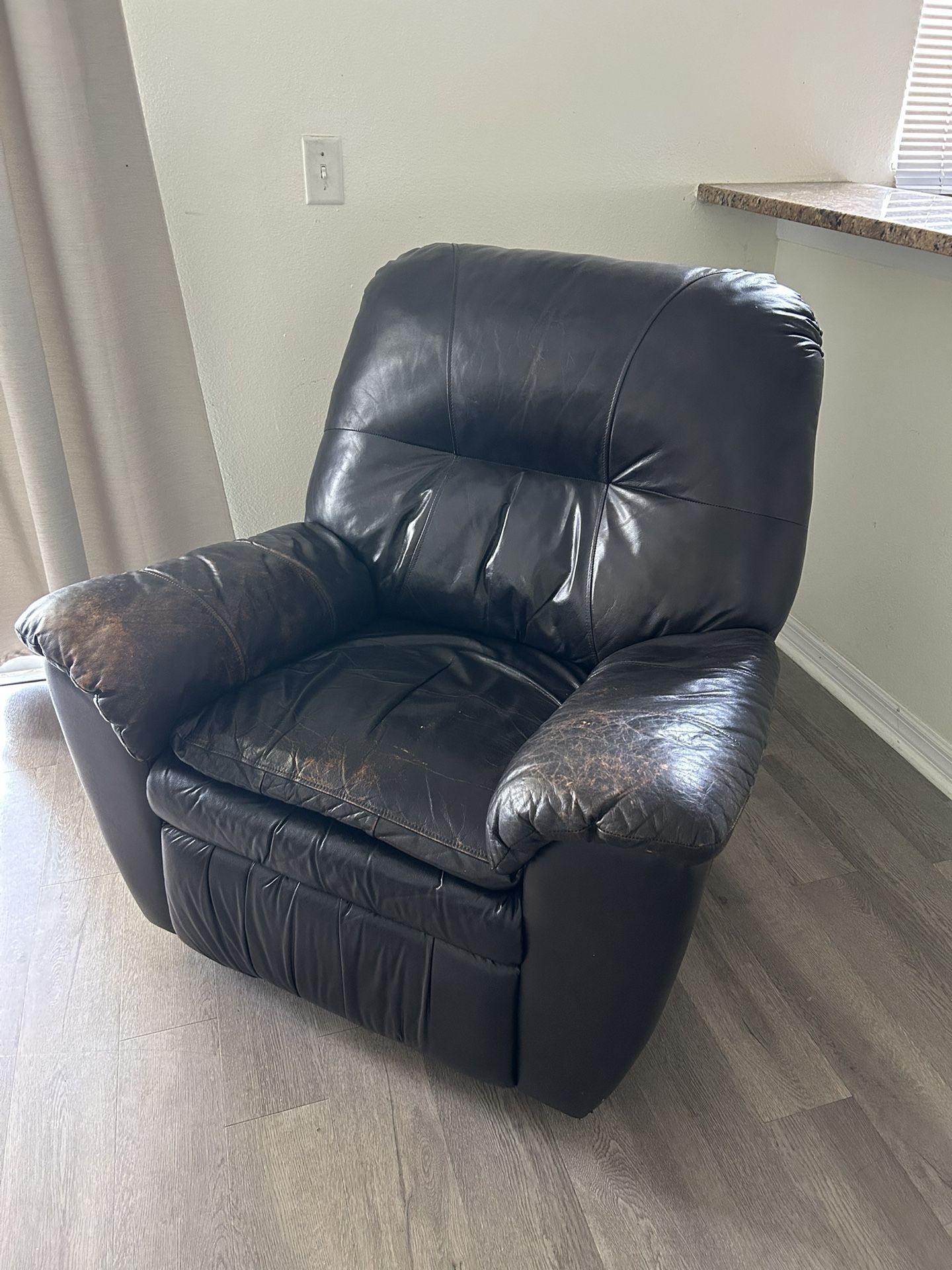 Leather swinging recliner