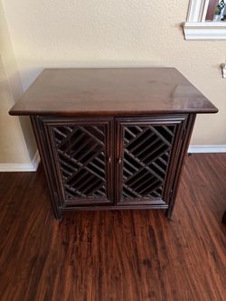 Dark Wood Cabinet with Lattice Door Panels