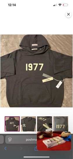 Essentials "1977" Hoodie - color: Black (A deep, washed black that looks premium and versatile).
