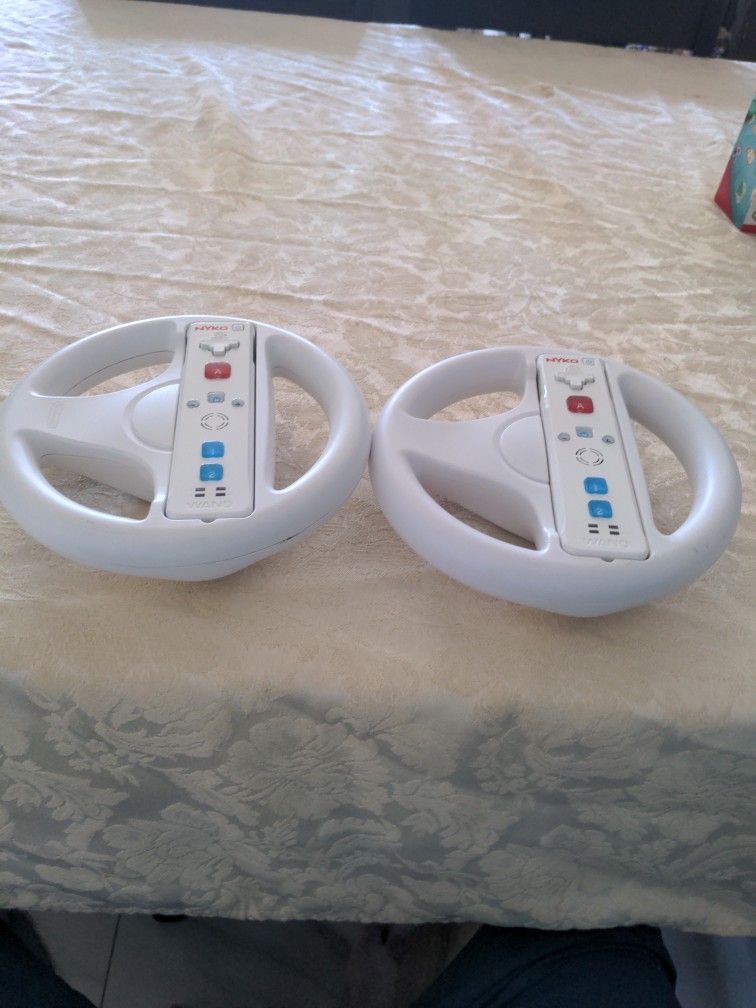 Two Nintendo Wheels Plus Controllers.