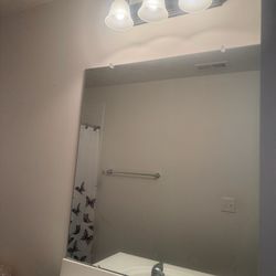 Bathroom Cabinets, Toilet, Lights, And Mirror