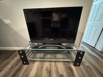 Glass TV stand and Sharp 48inch Aquos Tv with built in speakers