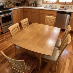 Beautiful solid dining table with  6 matching chairs