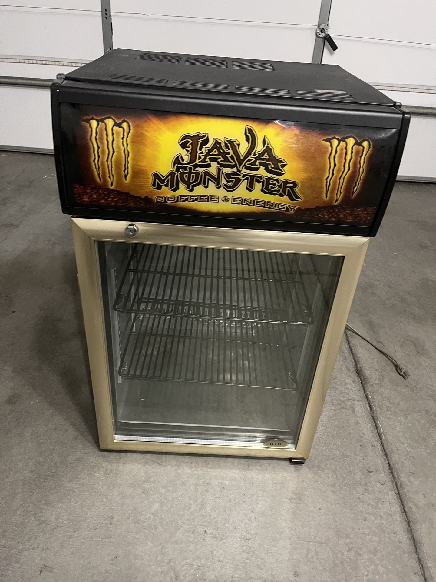 Java monster coffee energy rare mini fridge  Used some scratches from normal use please check all the pictures  Meserment:  High: 33” Wide: 20” Deep: 