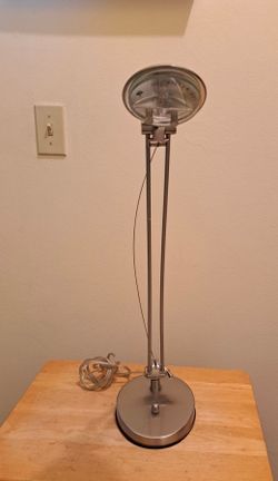 Dimmable Elegant Gold Adjustable Desk or Table Lamp with gradual light setting.