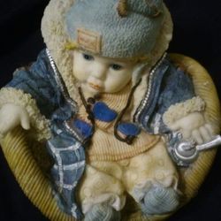 Cute baby girl in her easy chair