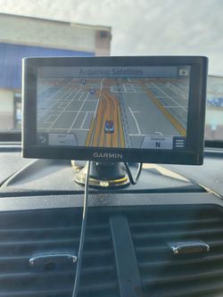 2 Garmin Auto GPS System. 