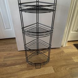 black metal three-tier corner shelf unit