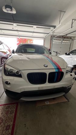 BMW X1 White SUV with M Stripes