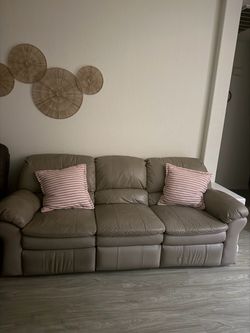 Grayish tan leather recliner couch