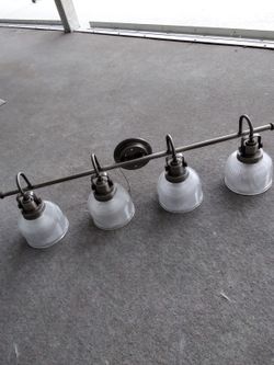 Bathroom Vanity Light. Sku P2997-81. Orig Price $215. Steel Construction. Antique Nickel. 4 Prismatic Glass Shades. 35 1/2 " Wide. 8 3/4"high. 10 Lbs.