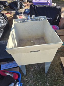 UTILITY SINK WITH NEW HOOK UPS