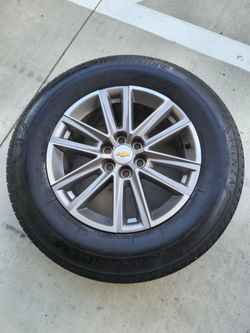 Set of four Bridgestone tires with stock Chevy wheels