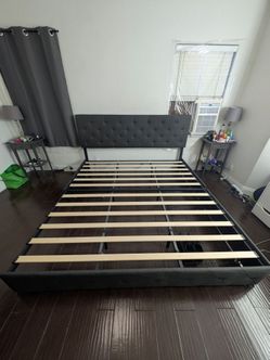 King size bed frame with rolling drawers underneath