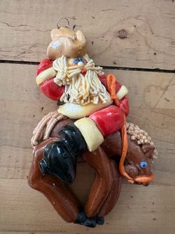 Vintage Neiman Marcus x Calliope Santa Bucking Bronco ornament