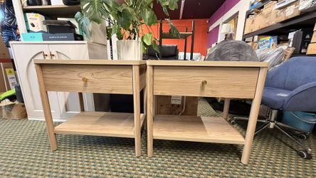 Modern Oak Nightstand A stylish and functional nightstand featuring a spacious drawer, open storage shelf, and sturdy solid wood legs. The natural oak