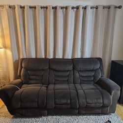 2 piece sofa recliners with cup holders and muddle storage.