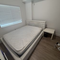 bed with two chests of drawers and a mattress 