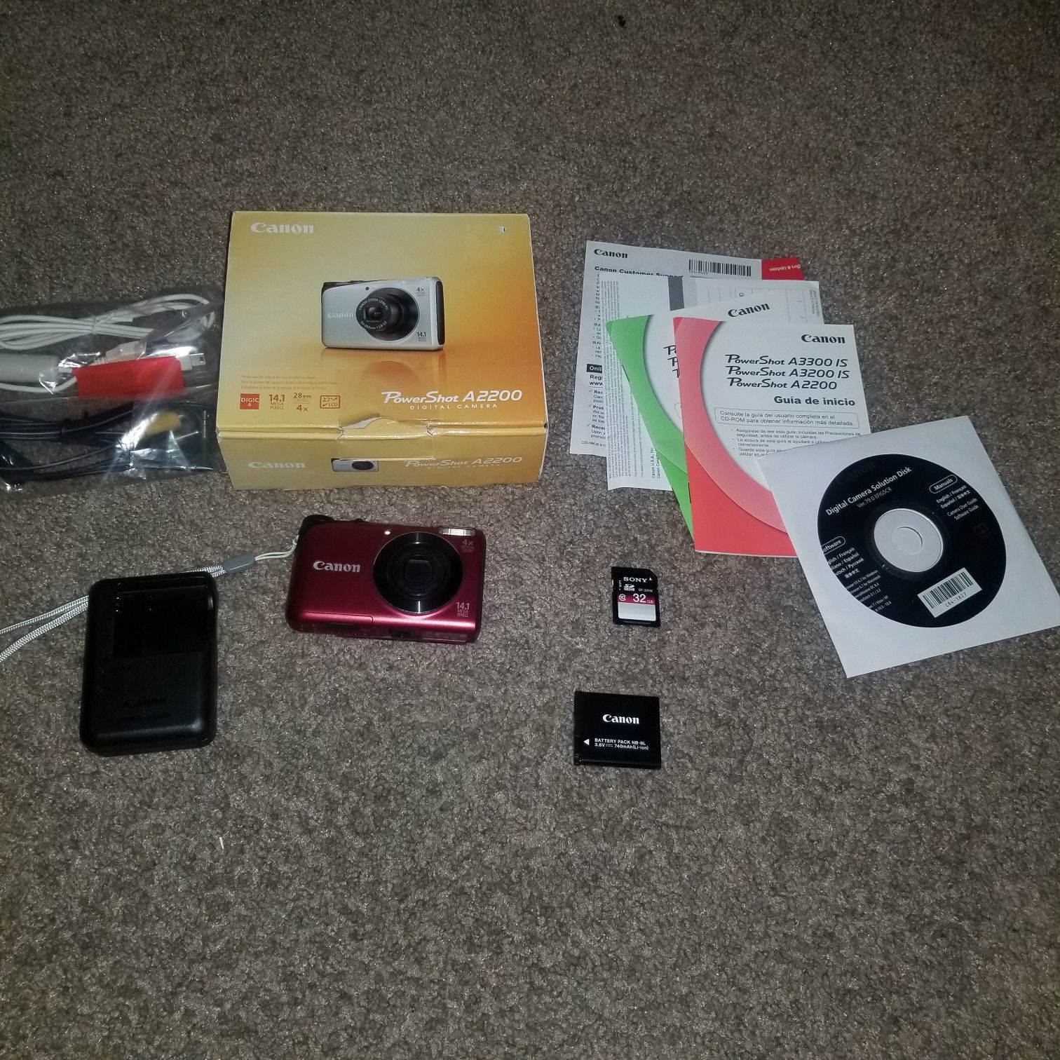 Canon PowerShot A2200 14.1 MP Digital Camera - Red - Bundle. Condition is Used. With charger/ battery, box manuals and cables and a