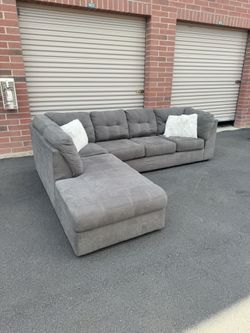 Gray sectional couch delivery available