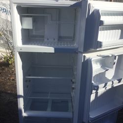 White Hotpoint refrigerator/ one year warranty/ delivery and installation are available