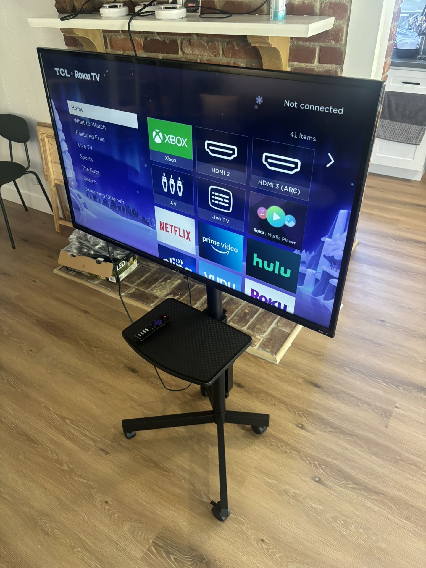 Rolling mounted TV stand plus TV