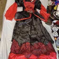 Child’s Dark Vampire Queen Halloween Costume. Looks like it fits size 7-8