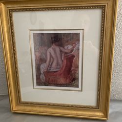 Beautiful girl seated on red sofa1876 print by Pierre Auguste Renoir in a gold frame , 17.5”x20”  Double matted The print size 8.5”x10”  Local pick up