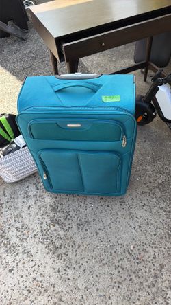 Turquoise green color suitcase