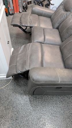 Faux leather double reclining sofa couch with hidden drawer. Works great!!