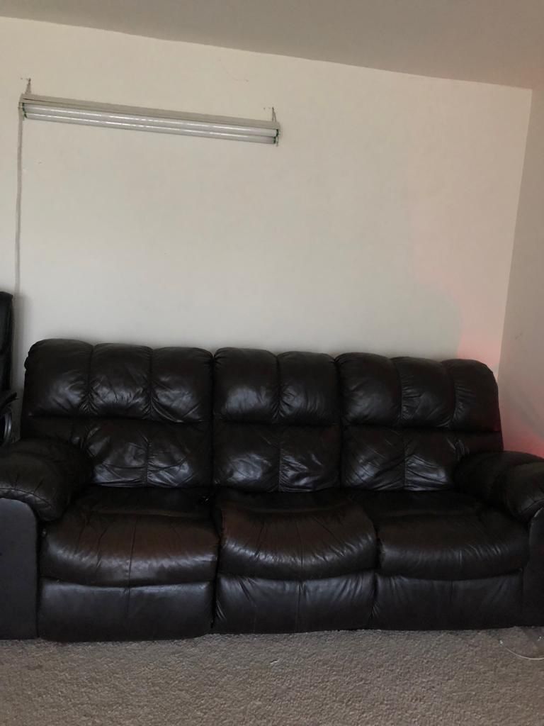 Ashley pure leather reclining sofa and loveseat in great condition.