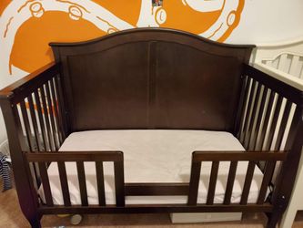 2 convertable cribs. Brown and white