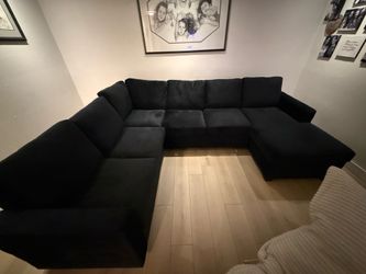 Black U shaped sectional with day bed and storage