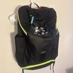 Under Armour black backpack with green accents